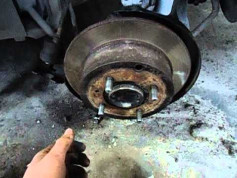 Where in Dodge Nitro is rear brake pads located