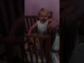 Funny Toddler Trying To Climb Out Of The Cot