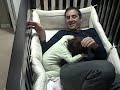 Father goes into baby crib!