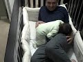 Father goes into baby crib!
