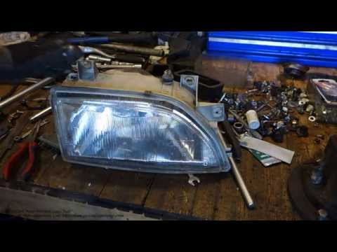 How works Ford headlight beam up and down system