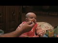Baby makes funny faces eating