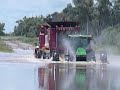 john deere and two case headers swimming
