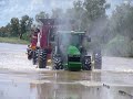 john deere and two case headers swimming