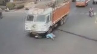 Truck runs over woman on scooter