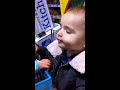 Baby boy kissing baby girl doll