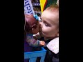 Baby boy kissing baby girl doll