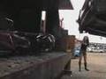 girl crushing a car with compactor
