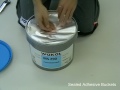 How to open sealed adhesive buckets