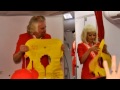 Sir Richard Branson dresses as an air hostess after losing bet with AirAsia chief