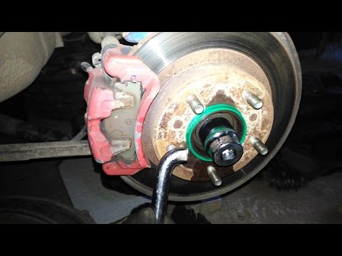 Unscrew the hub nut on Mazda