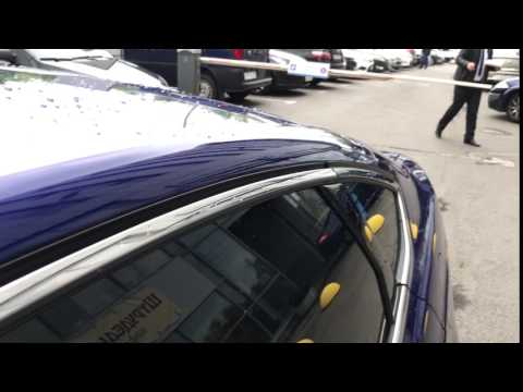 Расположение у Mazda 3 Седан кнопки открывания лючка бензобака