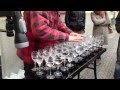 Street artist playing Hallelujah with crystal glasses