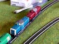 Doppelzug V100 BR 212 mit Tankwagons ueber Bergstrecke