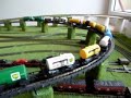 Doppelzug V100 BR 212 mit Tankwagons ueber Bergstrecke
