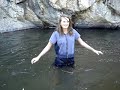 Schyeler dunking herself in the creek