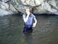 Schyeler dunking herself in the creek