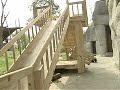 Cute pandas playing on the slide
