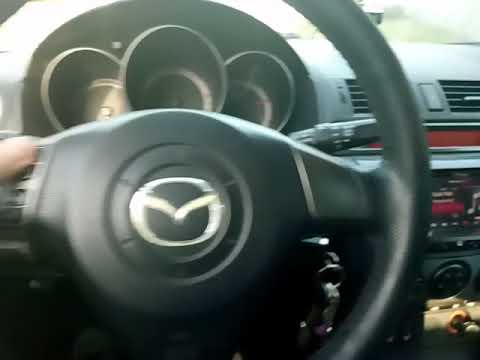 Emplacement du bouton de lève-vitre électrique Mazda 3