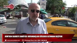 AVM'den caddeye bariyer: Vatandaşlar eğilerek altından geçiyor