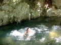 Lissa jumps in the pool of waterfall run-off first