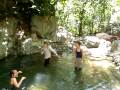 Lissa jumps in the pool of waterfall run-off first