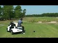 Slow motion golf swing from Solorider golf cart. Appox 200 yard drive.