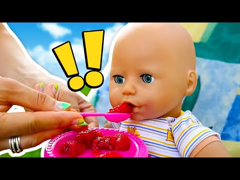 Baby Annabell doll goes for a walk. Baby dolls play with toys. The doll pretends to play cooking.