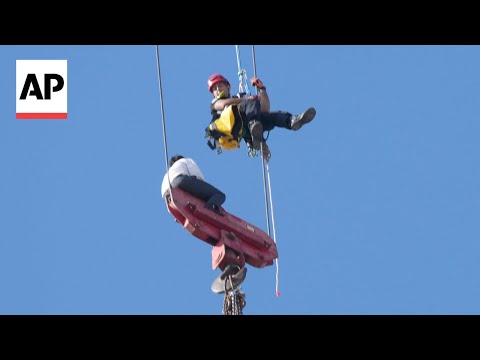 YouTube video thumbnail: Fire Teams Rescue Teen Dangling for Hours From 36-Story Crane in Jerusalem