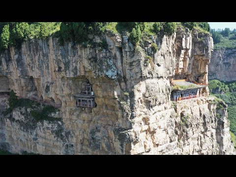 實拍中國北方唯一的古棧道遺址，長度達到21公里，上面還有幾棟房子立於懸崖絕壁之中，竟然還住了4個人，看完讓人害怕