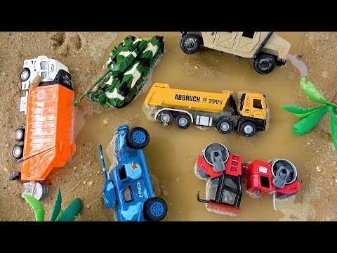 Toy construction vehicle buried under sand and the story of construction vehicle rescued by a crane