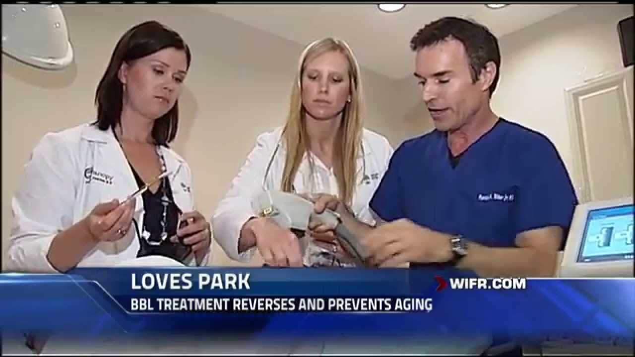 Man speaking on set of Aesthetic TV.