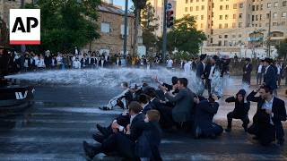 YouTube video thumbnail: Ultra-Orthodox Israeli Protesters Block Roads and Trains Over Military Draft