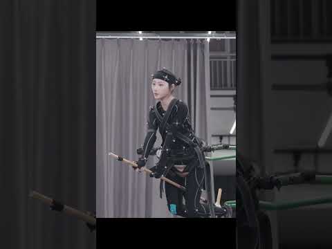 Motion capture actress manually takes off.