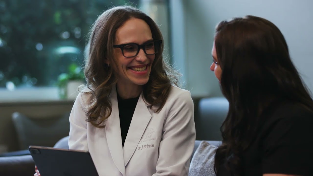 Doctor consulting with patient in clinic setting.