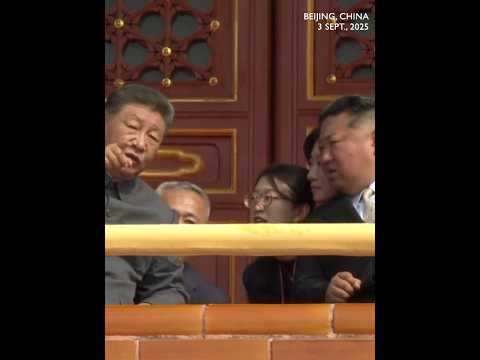 Kim Jong Un asks Xi questions during watching China's V-Day parade