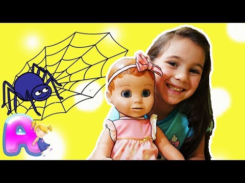 Anna plays with a doll to the song Itsy Bitsy Spider