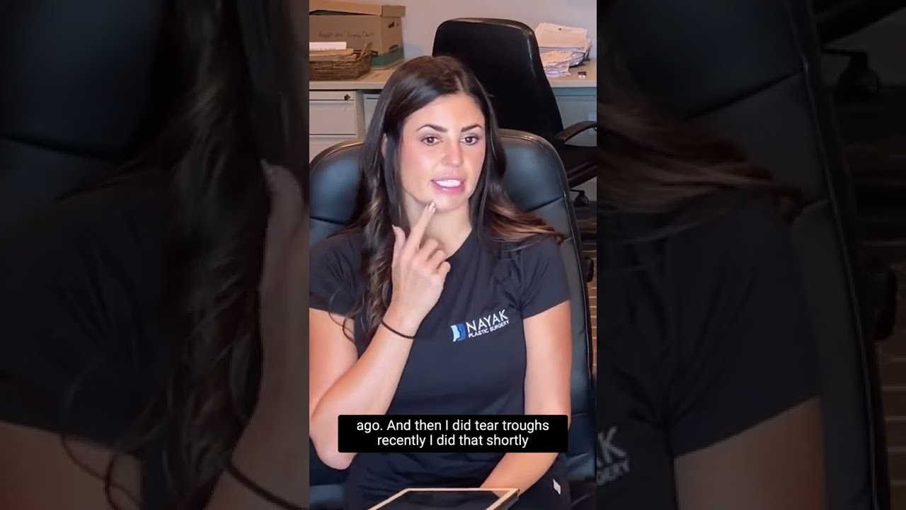Person discussing beauty treatments in an office.