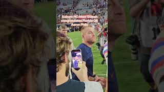 Auburn HC Akex Golesh congratulates Florida QB Aaron Philo Gators beat Tigers, 44.e9. AP aS wE C it
