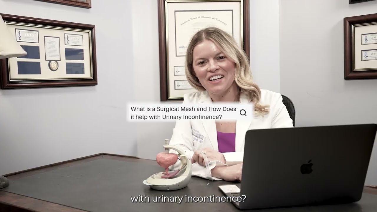 Woman smiling while holding a smartphone at desk.