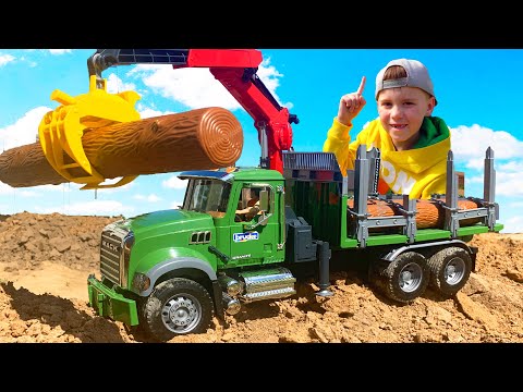 Coches para niños El tractor de ruedas grandes lleva un camión de madera y ayuda a Alex