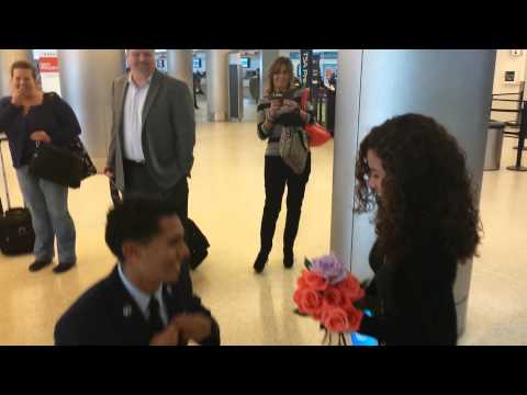 AWWW! Grab Some Tissues & Watch This Airman's ADORABLE Rose-Filled Airport Proposal!