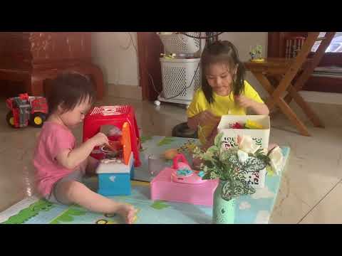 The two sisters played together while their mother cooked