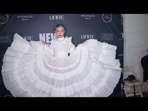 Model Alexandra Lenarchyk poses backstage at Artheartsfashion NYFW