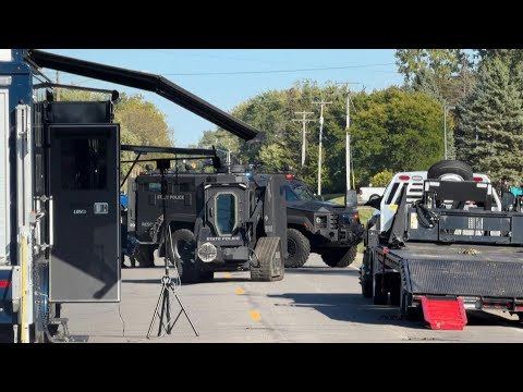 Police outside home of suspected church shooter in Michigan | AFP