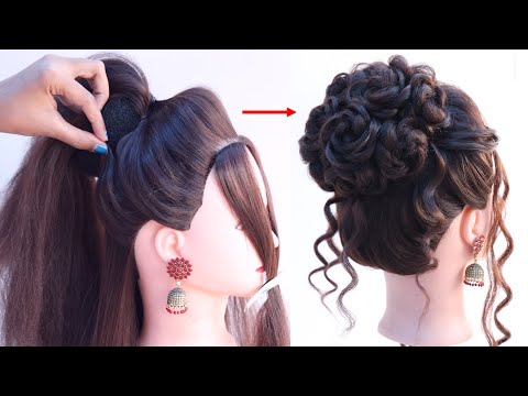 very beautiful messy high bun hairstyle for wedding gown