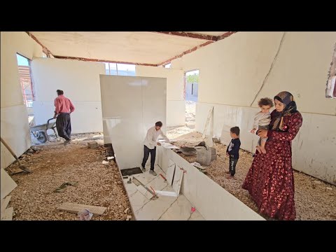 Tiling the floor of the milking station with Sami's help.Tayyaba seeks progress