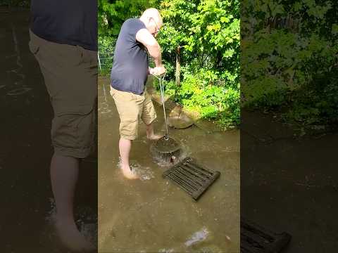 S#047-1  Unclogging a storm drain after heavy rain in Germany, #shorts