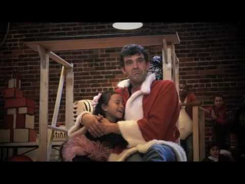 Issadora N Issabela and Stefán Karl rehearsing for the Grinch, she is hugging him.