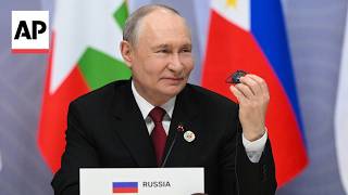 YouTube video thumbnail: Putin Joins ASEAN Leaders for Family Photo Before First Talks of Joint Summit in Russia